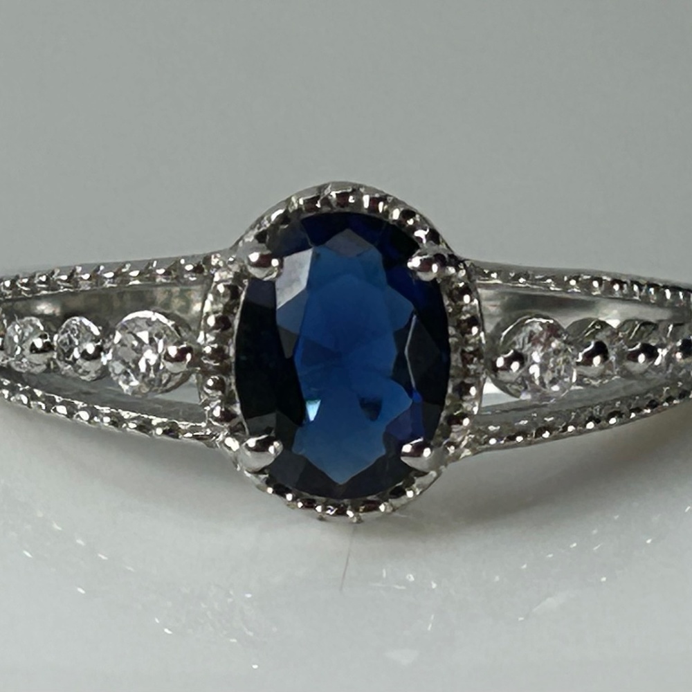 Sterling silver lab created blue sapphire with white sapphires down sides